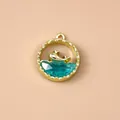 Golden sea series round pendant with jumping dolphin and blue faceted gemstone charm - Gold Blue