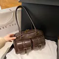 Vintage dark brown Boston bag with front pockets and golden buckle details - Brown