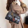 Retro black leather Boston bag with dual buckle pockets and vintage gold hardware - Black With Rabbit Pendant
