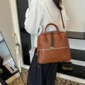 Cartella vintage in pelle marrone con cerniera intrecciata e tracolla regolabile - 31*11*25 / Marrone senza ciondoli