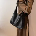 Large black hobo shoulder bag in premium lychee grain leather for women - Black