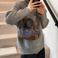 Vintage denim and brown leather bowling bag with contrast stitching and crossbody strap - 22x6x13cm / Dark Blue With Brown