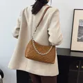 Caramel brown quilted leather shoulder bag with chic silver chain strap detail - Brown