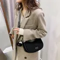 Black nubuck crescent bag with white contrast stitching and mini round coin purse charm - Black