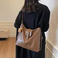 Brown large capacity leather shoulder bag for women with cute bear charm and golden hardware - 30*10*31 / Brown