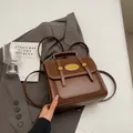 Deep brown leather and suede contrast backpack with oval gold plate and top handle - Without Pendant / Brown