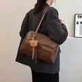 Vintage dark brown PU leather tote bag with functional front pockets and plush bear charm - 32*11*21 / Brown