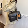Retro black matte leather shoulder bag with gold hardware and a cute bear charm - 32*11*21 / Black