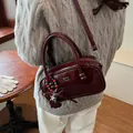 Burgundy patent leather crossbody bag with vintage star and heart charms - Red