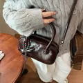 Dark brown patent leather shoulder bag with vintage texture and decorative pendant - Coffee with Pendant