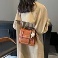 Vintage brown leather crossbody bag with white stitching and baseball charm - Brown (With Pendant)