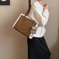 Brown faux leather tote bag with white faux shearling trim and gold chain detail - Brown