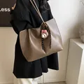 Minimalist large dark brown tote bag with plush bear charm and woven strap detail - Large / Khaki With Rabbit Pendant