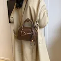 Dark brown retro leather handbag with metallic ring and bell pendant accessory - No Pendant / Brown