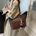 Dark brown textured leather tote bag with long straps and a plush rabbit charm - Without Pendant / Coffee
