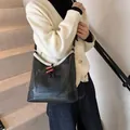 Retro black leather shoulder bag with white faux shearling trim and toggle button - 27*11.5*27 / Black