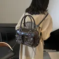 Chic dark brown glossy PU leather underarm bag with bow detailing and twin front pockets - Coffee
