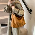 Minimalist brown suede tote bag featuring a spacious vintage design for shoulder wear - Large Style / Brown