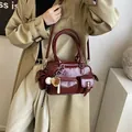Deep wine red multi-pocket bowling shoulder bag with vintage high-gloss finish and baseball charm - Burgundy Red With Charm
