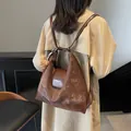 Vintage dark brown faux leather tote backpack for women with cute teddy bear charm - Coffee With Rabbit Pendant