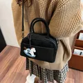 Chic black matte leather Boston bag for women with cute pony charm on shoulder strap - Black