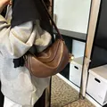 Dark brown half-moon hobo bag in glossy vintage faux leather with adjustable shoulder strap - With Pendant / Brown
