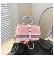 Detail of pink leather bag with woven flap and fluid silver sculptural metal handle - Pink