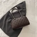 Dark brown quilted bowling bag with double top handles and golden hardware details - No Pendant / Coffee