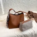 Brown litchi grain bucket bag with silk scarf handle and pink striped inner pouch - With Pendant / Brown