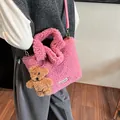 Pink faux fur bucket bag with a cute bear charm and adjustable shoulder strap - With Charm / Rose Red