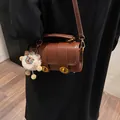 Vintage brown leather pillow bag with gold twist locks and cute plush sheep pendant - Brown with Pendant