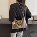 Brown vintage leather bucket bag with baseball pendant charm for women's crossbody wear - Mud Color (With Charm)