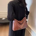 Brown vintage faux leather bucket bag with white stitching and mini baseball charm - Caramel Brown (With Charm)