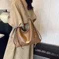 Brown high-capacity PU leather tote bag with gold hardware and adjustable strap - Brown