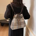 Brown plaid wool bucket backpack with adjustable leather straps and golden hardware - Blue Plaid