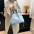 Puffy light blue quilted tote bag with drawstring detail and thick soft straps - Blue