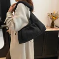 Black quilted crossbody bag featuring knotted shoulder strap and drawstring front pocket - 38*10*28.5cm / Black