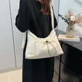 Beige padded drawstring tote bag with knotted shoulder strap and pleated texture - 38*10*28.5cm / White