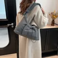 Dark grey padded nylon tote bag featuring a stylish knotted strap and drawstring front pocket - 38*10*28.5cm / Gray