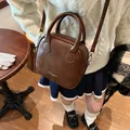 Vintage brown leather crossbody pillow bag with patchwork stitching and top handle - 21*8*18 / Brown