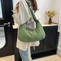 Green quilted hobo bag with adjustable wide shoulder strap and cloud-like texture style - Green