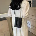 Mini black pebbled leather crossbody phone bag for women with elegant shoulder strap - 15*6*19 / Black