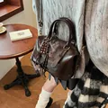 Vintage dark brown gloss Boston bag with chocolate charm and adjustable strap - No Pendant / Brown