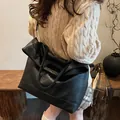 Large black soft leather tote bag with unique textured handles and detachable shoulder strap - 34x13x42 / Black
