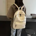 Quilted white puffer backpack with glossy finish and spacious padded compartments - 30*13*40 / Off White