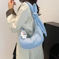 Light blue padded crescent shoulder bag with bunny ear knot strap and plush sheep charm - One Size / Blue