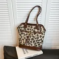 Leopard print faux fur tote bag with dark brown leather straps and gold metal buckle detail - Khaki Leopard