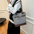 Gray tweed tote bag with dark brown leather straps and golden horsebit detail on the front - Gray