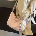 Pink velvet hobo bag with plush bear charm and adjustable strap for women - Pink