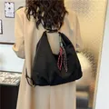 Minimalist black frosted leather tote bag featuring a tricolor braided rope pendant accent - With Pendant / Black